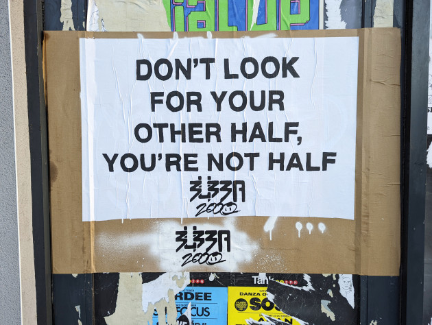 Paste-up with the words 'Don't Look For Your Other Half, You're Not Half'