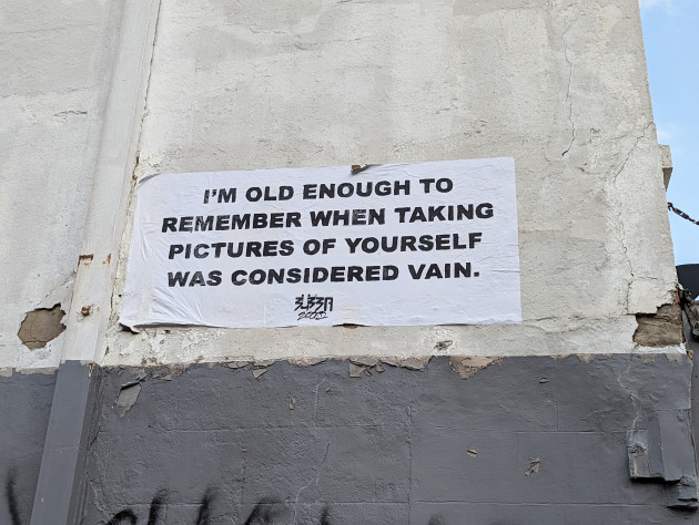 Paste-up with the words 'I'm old enough to remember when taking pictures of yourself was considered vain'
