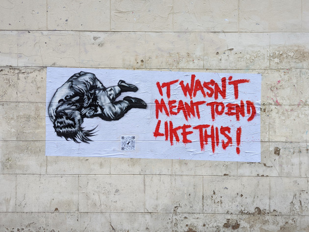 Paste-up artwork featuring a curled up figure next to the words 'It Wasn't Meant to End Like This!'