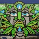 Mural of some sort of green deity or creature