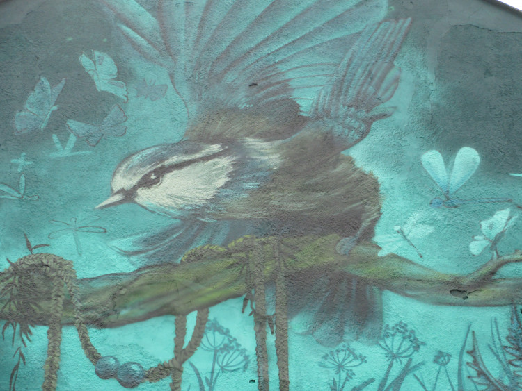Close up of a mural by Faunagraphic depicting a bird