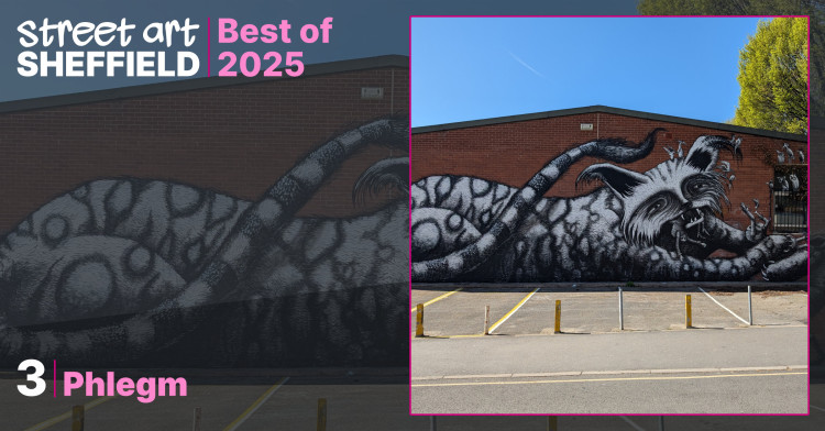 Large black and white mural of a giant cat lying down eating human like figures