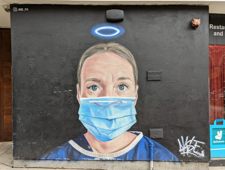 Mural of a masked NHS nurse by Akse
