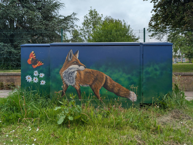 Street cabinet fainted with a mural of a red fox