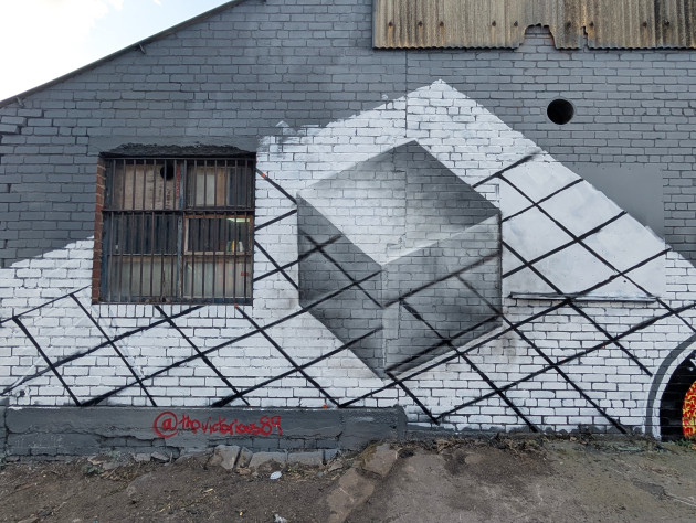Mural of a cube on a grid background