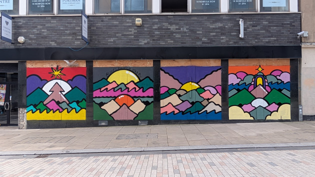 Mural consisting of four panels featuring abstract hillside landscapes in vibrant colours
