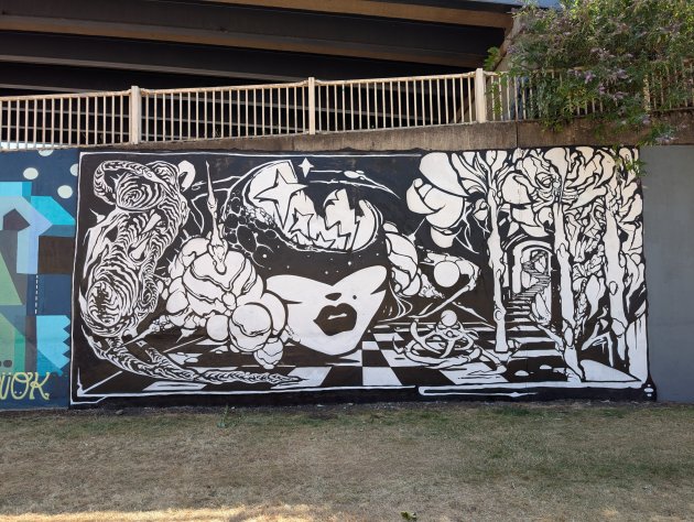Black and white cyberpunk mural by Mila K