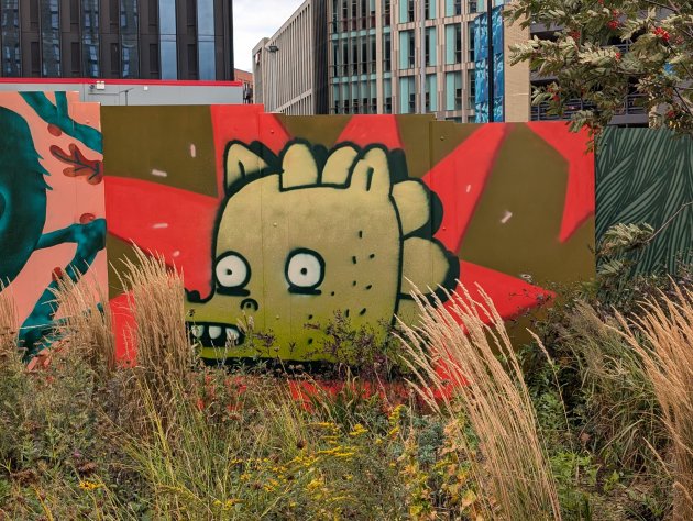 Mural of a cartoon style dinosaur head