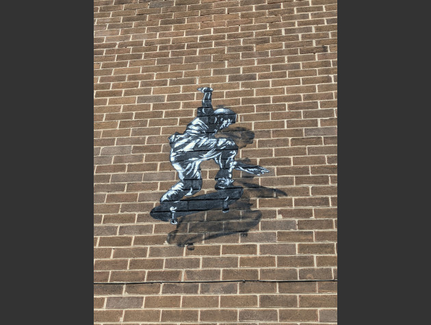 Small stencil mural of a skateboarder