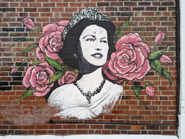 Mural of a young Queen Elizabeth the second surrounded by flowers