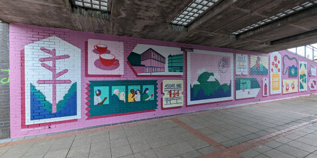 Long colourful mural featuring illustrations of local icons including the Crucible theatre, Peak District and a tram ticket