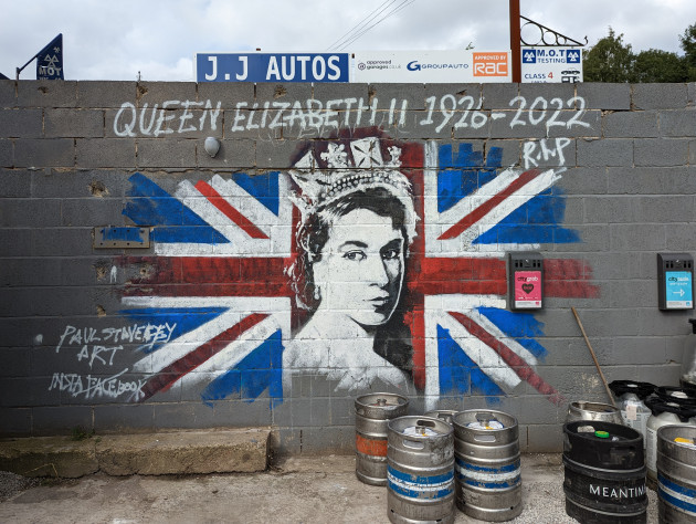 Painted mural of a young Queen Elizabeth II against a Union Jack backdrop