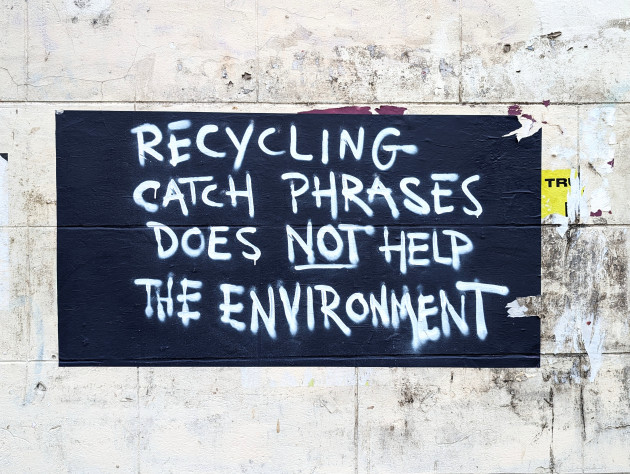 Paste-up with the words 'Recycling catch phrases does not help the environment'