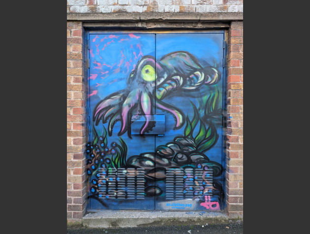 Doors painted with an aquatic theme featuring an octopus