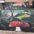 Close-up of the mural featuring a small tit on a toadstall