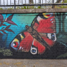 Close up of the mural featuring a colourful butterfly