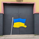 Ukrainian flag and flag pole painted onto some garage doors