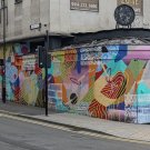 Abstract mural composed of colourful shapes and patterns