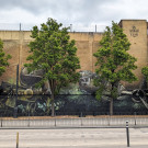 Part of a huge mural featuring a steam train and a plane